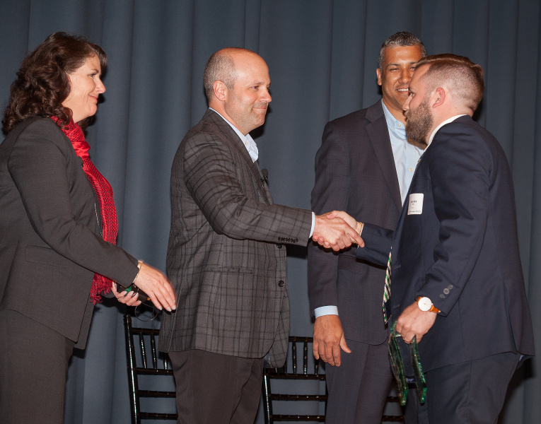 Josh Hick receives the Quarterback of the Year Summit Award.