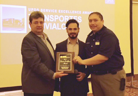 Alejandro Medina and Jose Guzman present Alfredo Garza the Service Excellence Award.