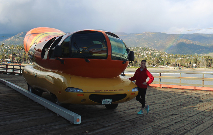 Ashley poses with the Oscar Mayer Wienermobile at the Stearns Wharf Pier in Santa Barbara, California.