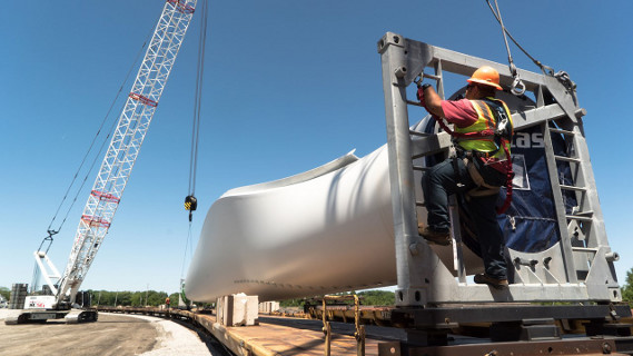  54-meter blade being prepped for unloading from railcar at one of Loup’s
                                        Iowa Wind Distribution Centers.